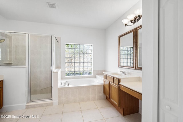 bathroom featuring tile patterned floors, vanity, and plus walk in shower