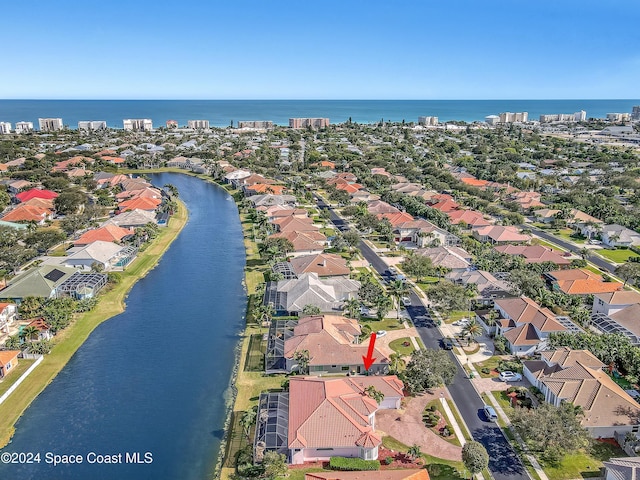 birds eye view of property featuring a water view