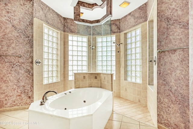 bathroom with tile patterned floors and separate shower and tub