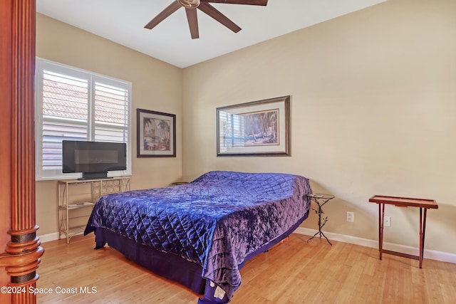 bedroom with ceiling fan and light wood-type flooring