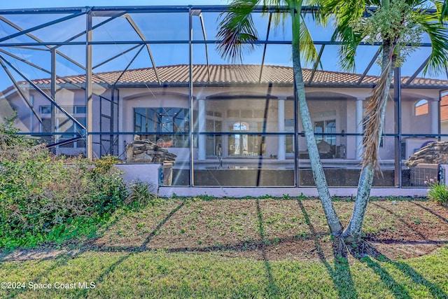 back of house with a lanai