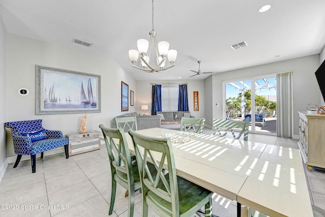 dining space with a chandelier and light tile patterned flooring