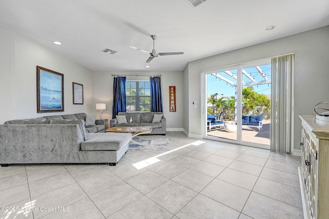 living room with light tile patterned flooring and ceiling fan