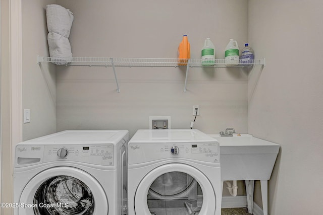 washroom featuring washer and clothes dryer