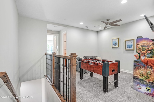 recreation room featuring ceiling fan and carpet