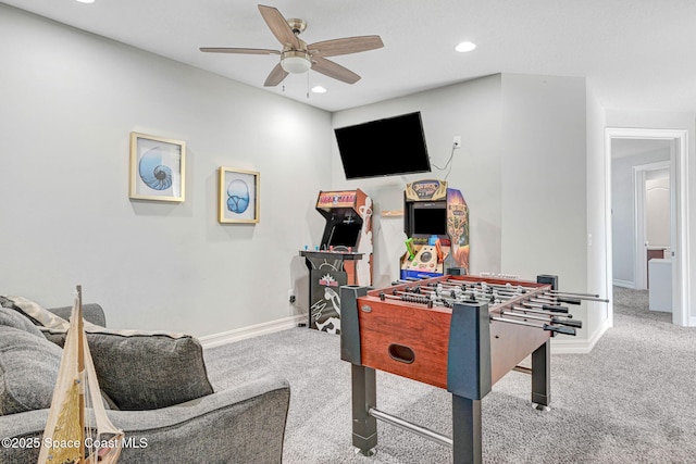 rec room featuring ceiling fan and carpet