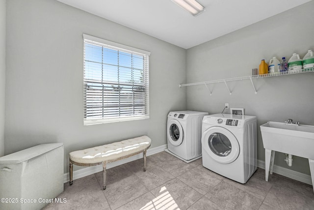 laundry area with independent washer and dryer