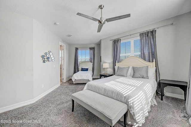 bedroom featuring a textured ceiling, ceiling fan, and carpet flooring