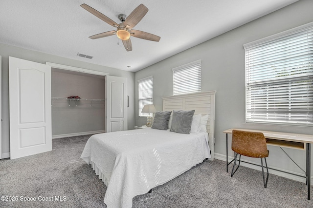 bedroom featuring carpet floors, ceiling fan, and a closet