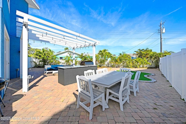 view of patio featuring a pergola and a bar