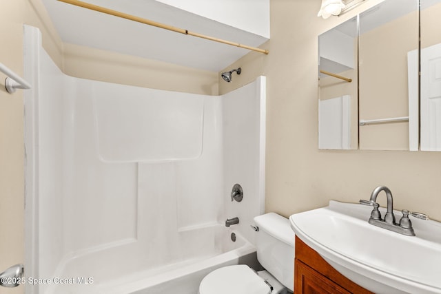 full bathroom featuring shower / tub combination, vanity, and toilet