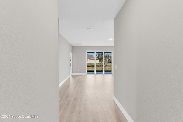 hallway featuring light wood-type flooring