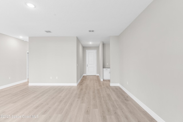 unfurnished room featuring light wood-type flooring