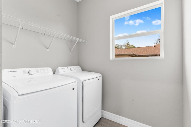 washroom featuring separate washer and dryer and hardwood / wood-style floors