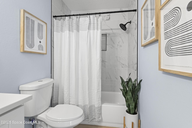 full bathroom featuring shower / bath combination with curtain, vanity, and toilet