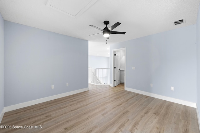 spare room featuring ceiling fan and light wood-type flooring