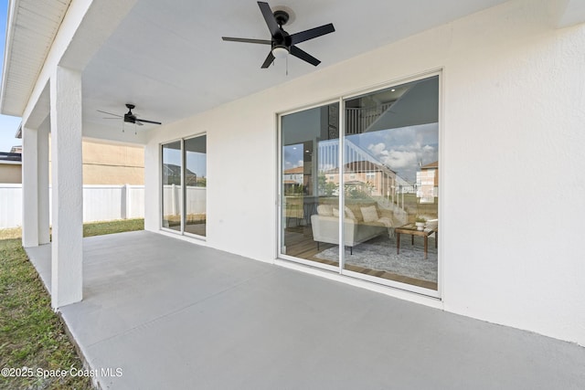 view of patio featuring ceiling fan