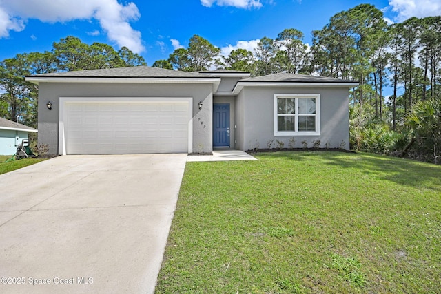 single story home with a garage and a front lawn