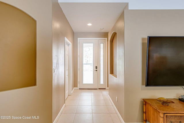 interior space with light tile patterned floors, recessed lighting, and baseboards