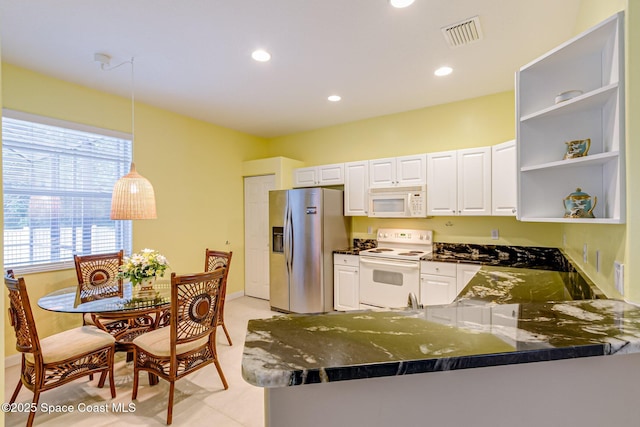 kitchen with open shelves, visible vents, white appliances, and white cabinetry