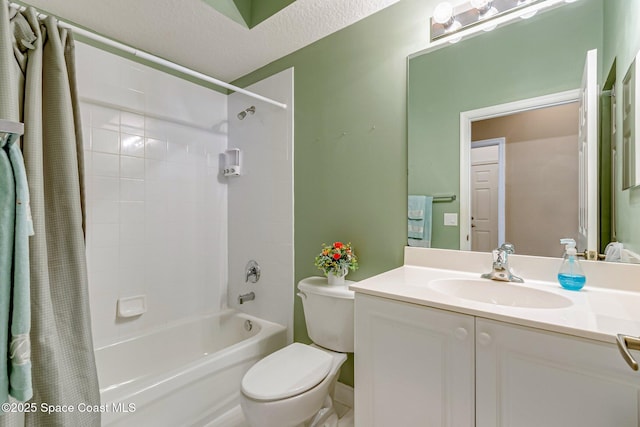 bathroom with toilet, shower / bath combo, vanity, and a textured ceiling