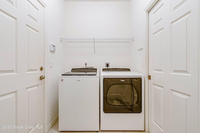 laundry area with separate washer and dryer and laundry area