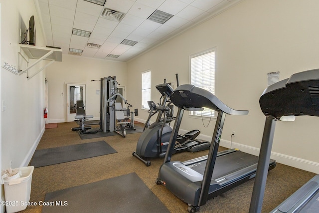 exercise room featuring visible vents and baseboards