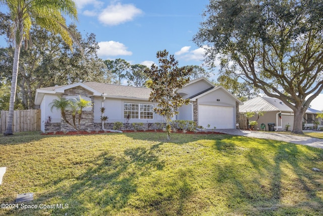 single story home with a garage and a front lawn