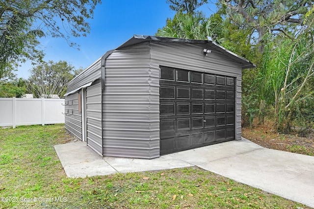 garage featuring a yard