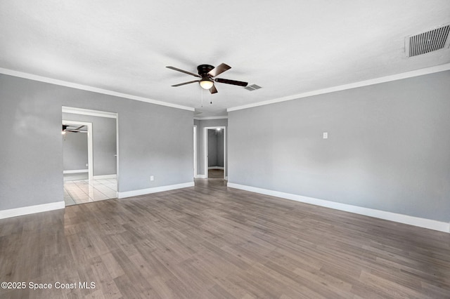 empty room featuring crown molding, ceiling fan, and light wood-type flooring