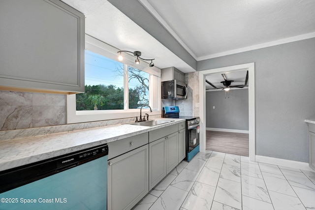 kitchen with sink, crown molding, ceiling fan, appliances with stainless steel finishes, and gray cabinetry