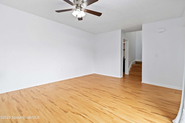 unfurnished room with ceiling fan and light hardwood / wood-style floors