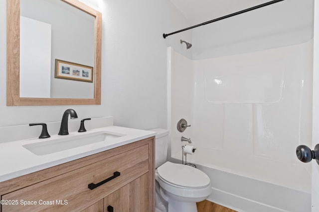 full bathroom with shower / bathtub combination, vanity, and toilet