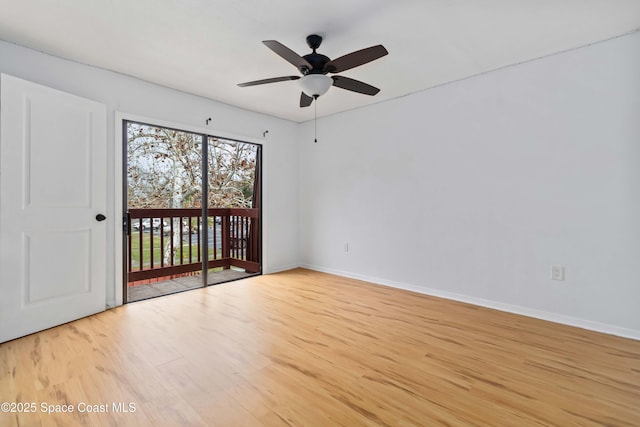 empty room featuring ceiling fan and light hardwood / wood-style flooring