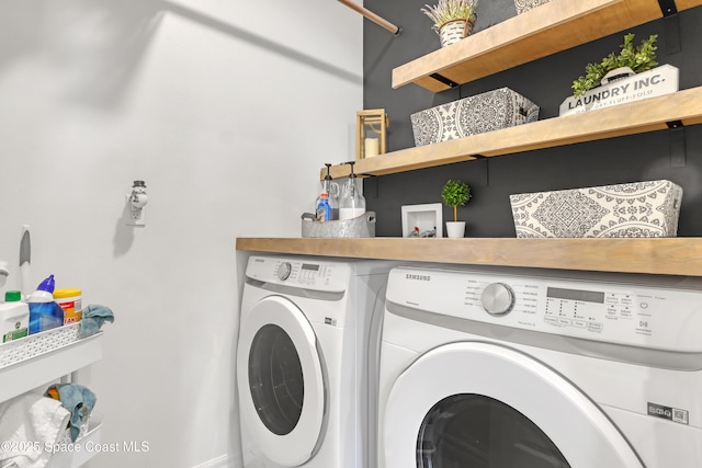 laundry room with washing machine and dryer