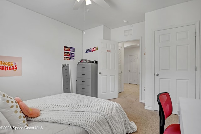 carpeted bedroom featuring ceiling fan