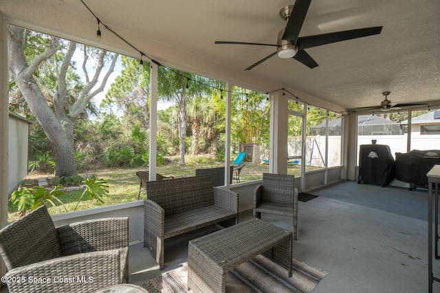 sunroom / solarium with ceiling fan