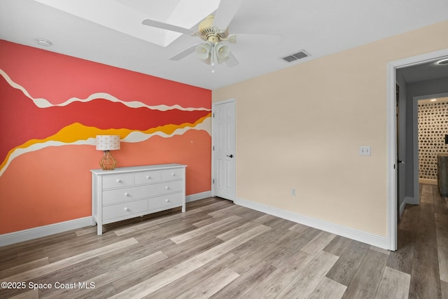 unfurnished bedroom featuring light hardwood / wood-style floors and ceiling fan