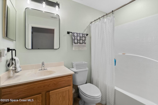 full bathroom with shower / bath combination with curtain, vanity, and toilet