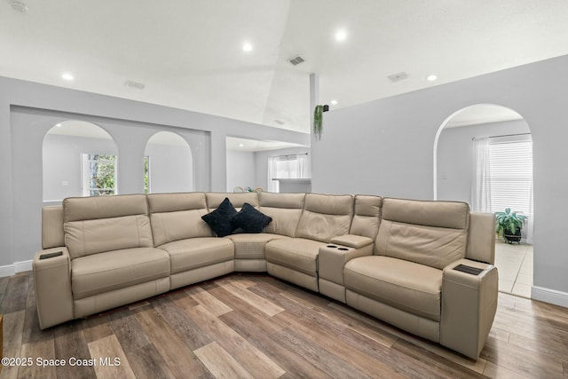 living room featuring a wealth of natural light and light hardwood / wood-style floors