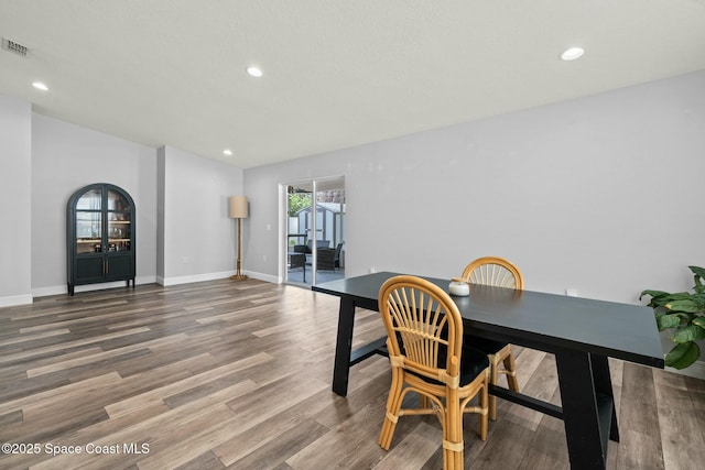 home office with hardwood / wood-style floors