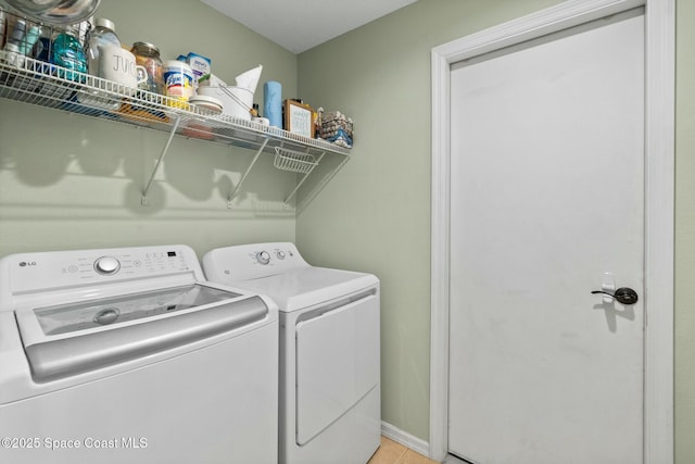 laundry room with separate washer and dryer