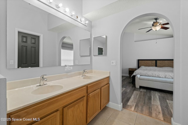 bathroom featuring tile patterned flooring, vanity, and ceiling fan