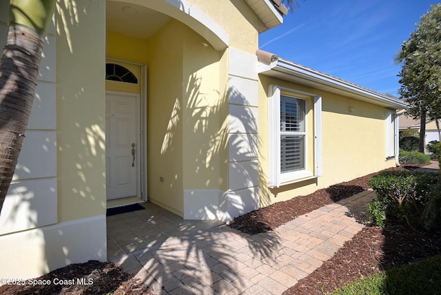 entrance to property with a patio area