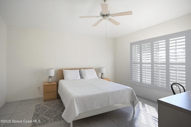 bedroom featuring tile patterned flooring and ceiling fan