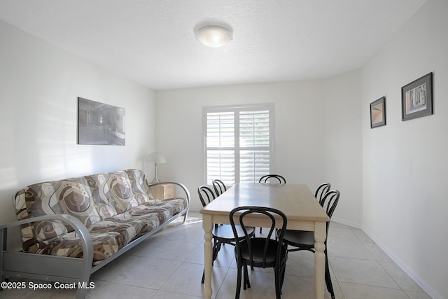 view of tiled dining space