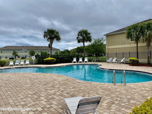 view of swimming pool featuring a patio