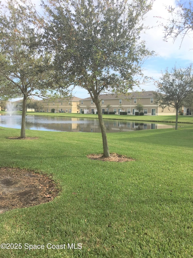 view of yard with a water view