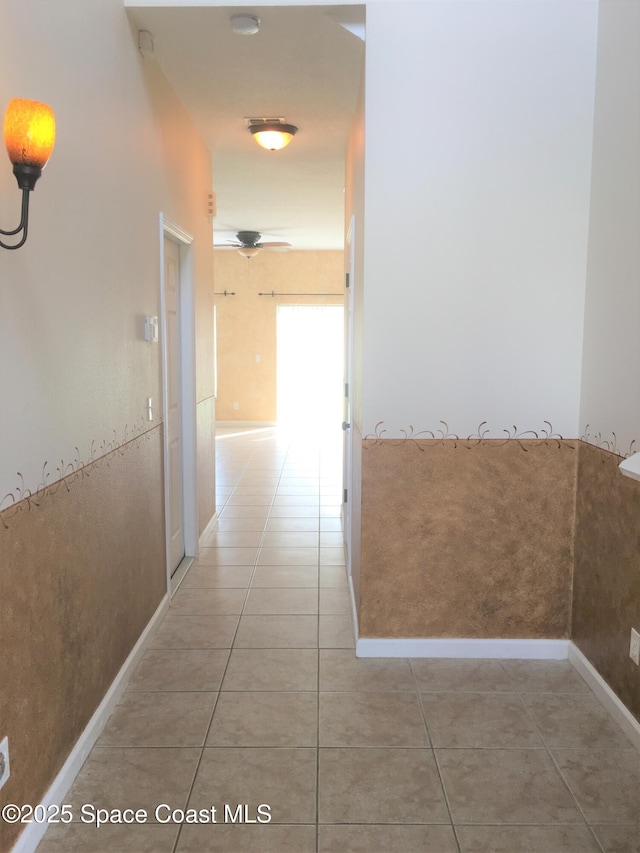 hallway featuring tile patterned flooring