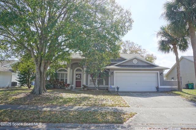 view of front of home featuring central AC unit, a garage, driveway, and stucco siding